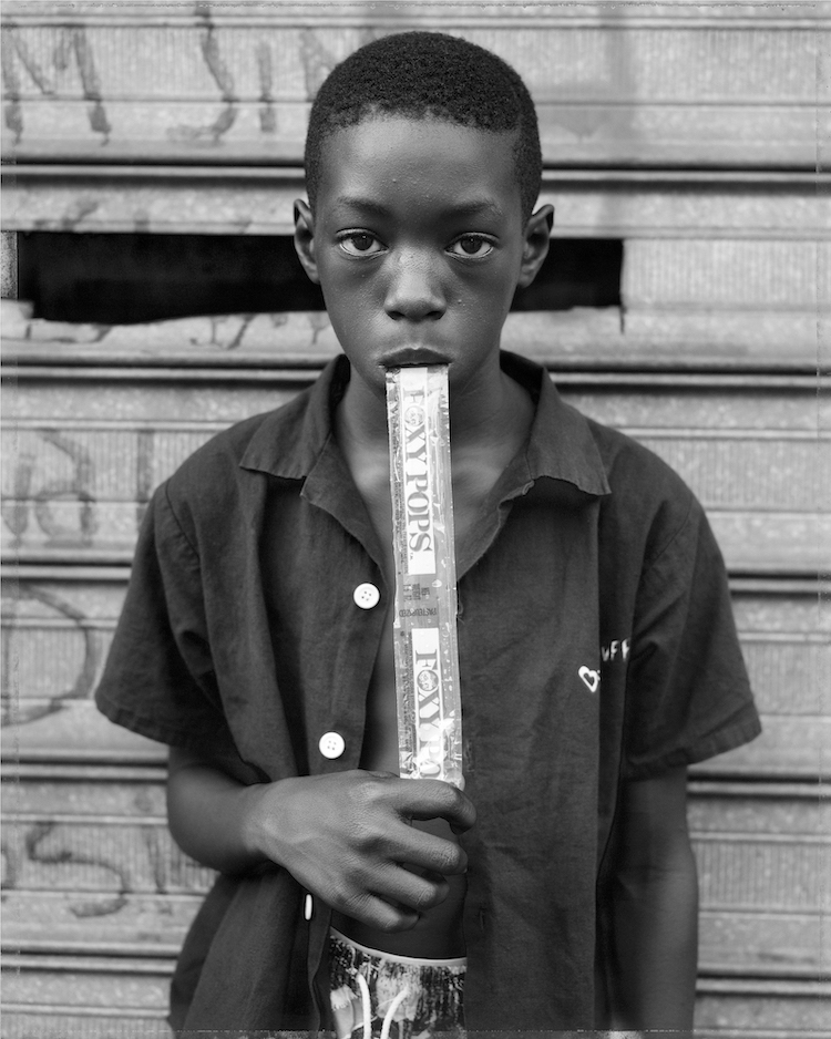 Dawoud Bey, “A Boy Eating a Foxy Pop, Brooklyn, NY,” 1988; courtesy the artist and Sean Kelly Gallery, Stephen Daiter Gallery, and Rena Bransten Gallery; © Dawoud Bey 
